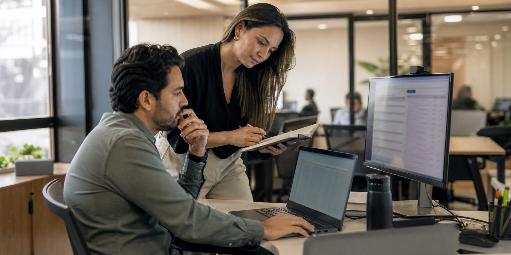 Sales Representative Working With Consultant In Modern Office